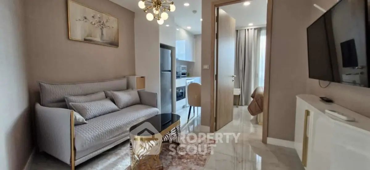 Modern living room with elegant decor and open kitchen layout