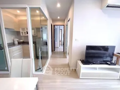 Modern apartment interior with open layout and sleek kitchen design