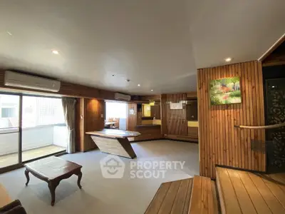 Spacious living room with wooden accents and natural light