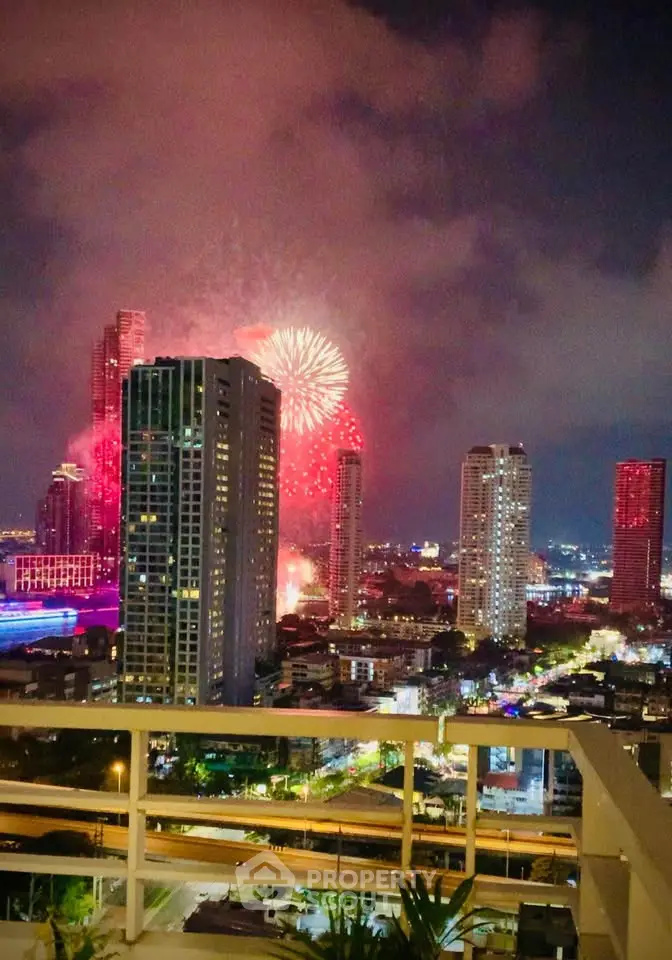 Stunning cityscape view with fireworks illuminating the night sky, perfect for urban living enthusiasts.