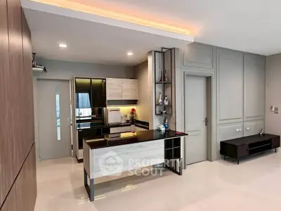 Modern kitchen with sleek design and open layout in a stylish apartment.