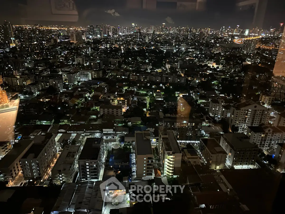 Stunning cityscape night view from high-rise building window