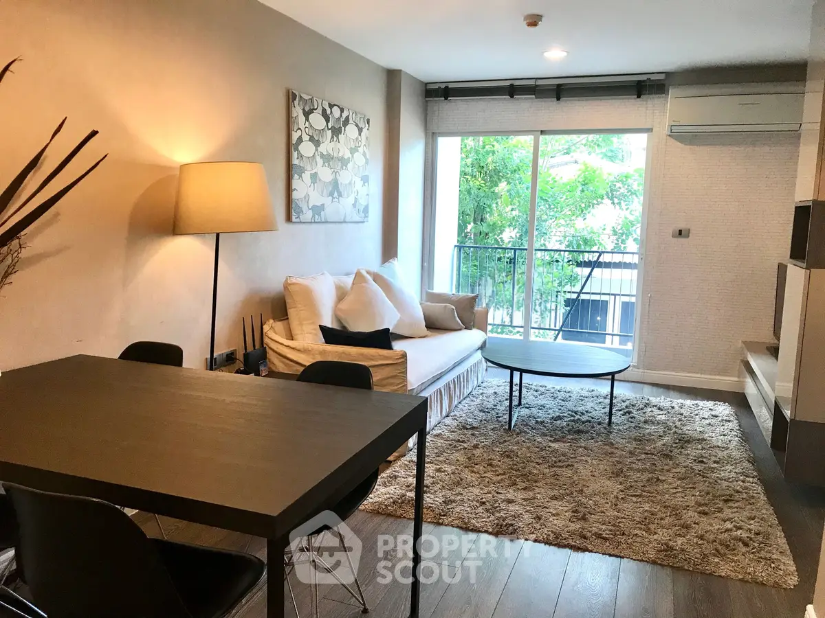 Chic modern living room with cozy sofa and large window view