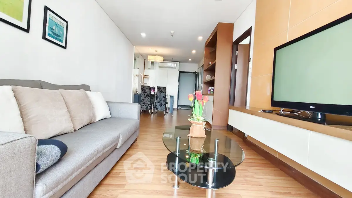 Spacious modern living room with stylish decor and natural light