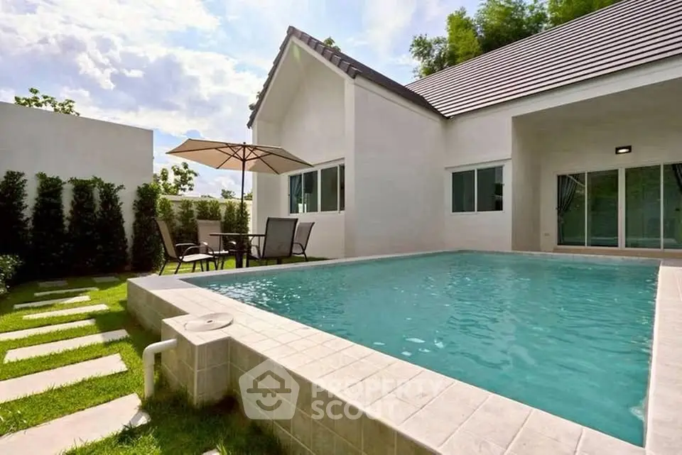 Charming modern home with private pool and lush garden, perfect for relaxation and outdoor entertainment.