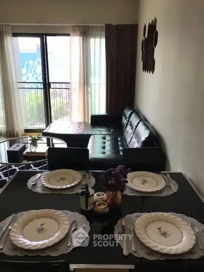 Chic living room with elegant dining setup and modern furniture, perfect for urban living.