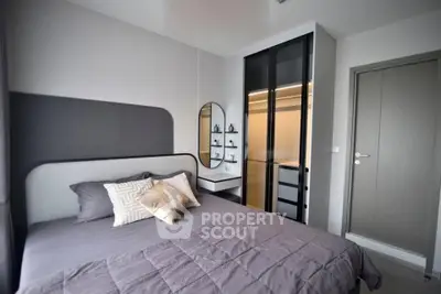 Modern bedroom with stylish decor and built-in closet