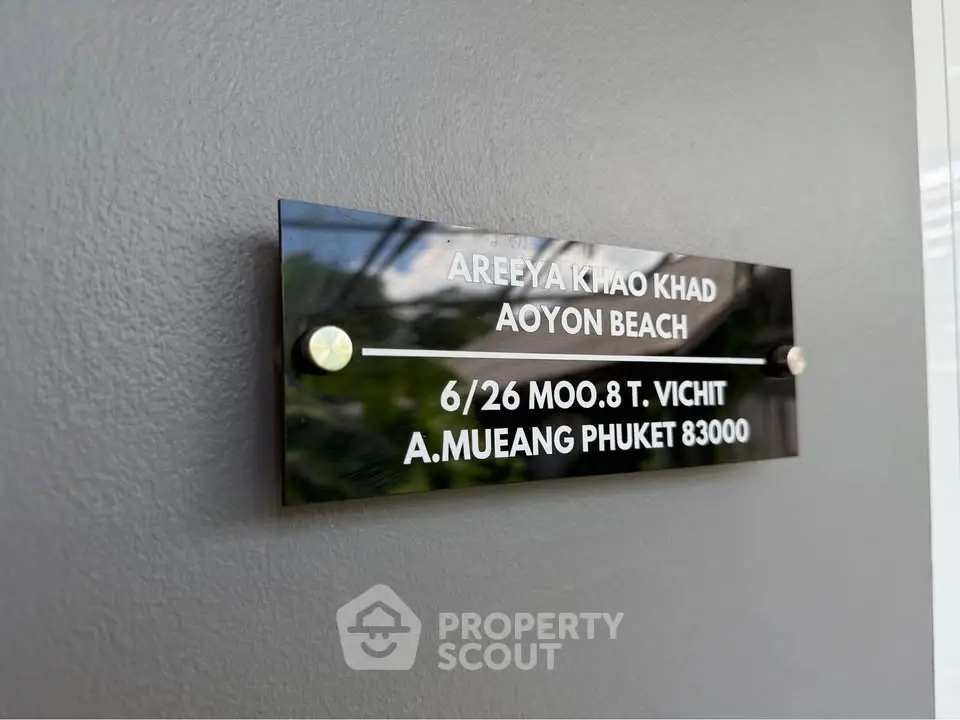 Modern property sign at Areeya Khao Khad, Aoyon Beach, Phuket, showcasing sleek design and prime location.
