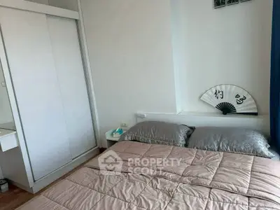 Cozy bedroom with modern decor and ample storage space