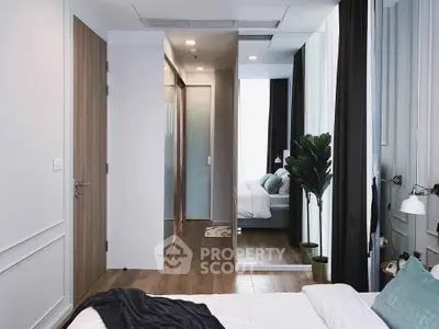 Modern bedroom with mirrored closet doors and elegant decor