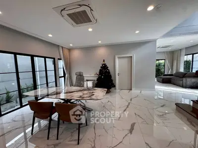 Luxurious modern living room with marble flooring and Christmas decor