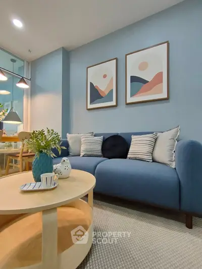 Stylish living room with modern blue sofa and chic decor