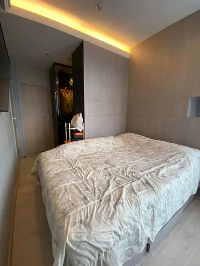 Cozy modern bedroom with stylish lighting and wooden accents