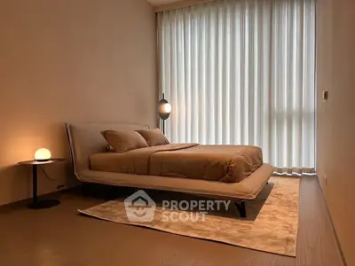 Elegant minimalist bedroom with modern decor and soft lighting