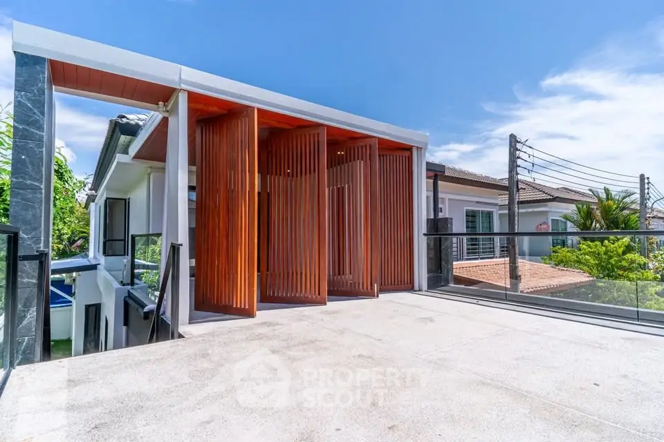 Modern rooftop terrace with sleek design and panoramic views in a luxury residential property.