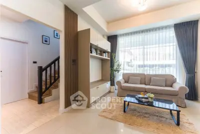 Spacious living room with modern decor and natural light