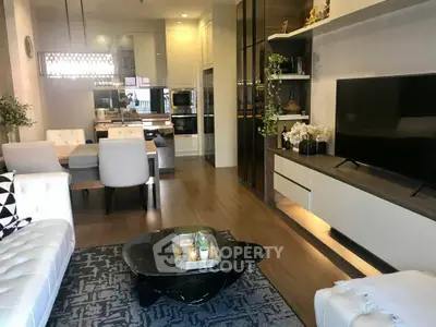 Luxurious modern living room with elegant decor and open kitchen layout, perfect for stylish urban living.
