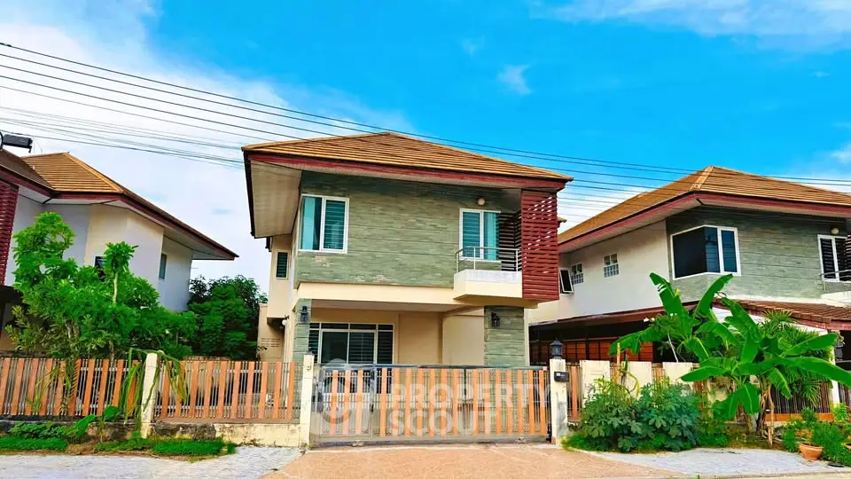 Charming two-story house with modern design and lush garden in a serene neighborhood.