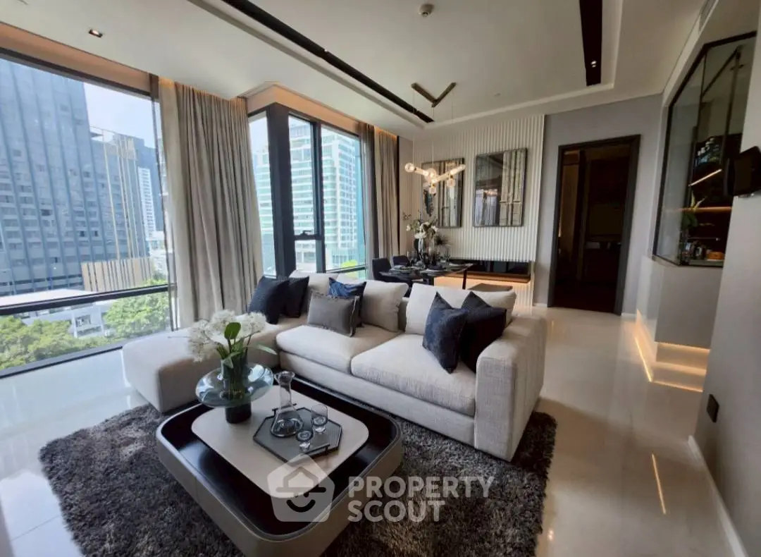 Luxurious modern living room with panoramic city views and elegant decor.