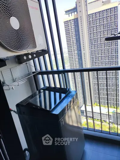 High-rise balcony with washing machine and city view, perfect for urban living.