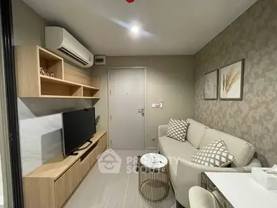 Modern living room with stylish decor, featuring a cozy sofa, wall-mounted TV, and elegant shelving.