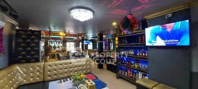 Luxurious lounge with plush seating and vibrant decor, perfect for entertaining.