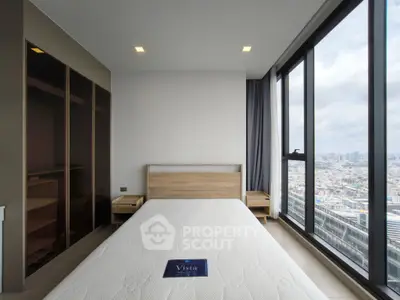 Modern bedroom with panoramic city view and sleek wooden furniture