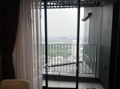 Stunning high-rise apartment balcony with panoramic city view, perfect for urban living enthusiasts.