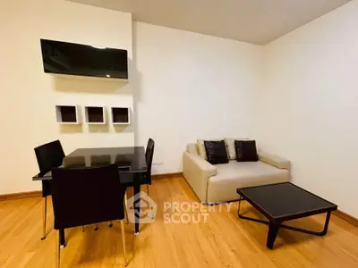Modern living room with sleek furniture and wall-mounted TV, perfect for stylish urban living.