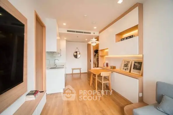 Modern living room with open kitchen and stylish wooden flooring