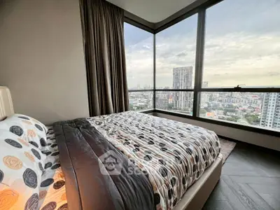 Luxurious bedroom with panoramic city view and modern decor