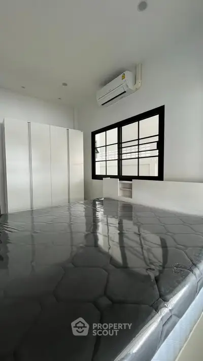 Modern bedroom with sleek design and air conditioning unit