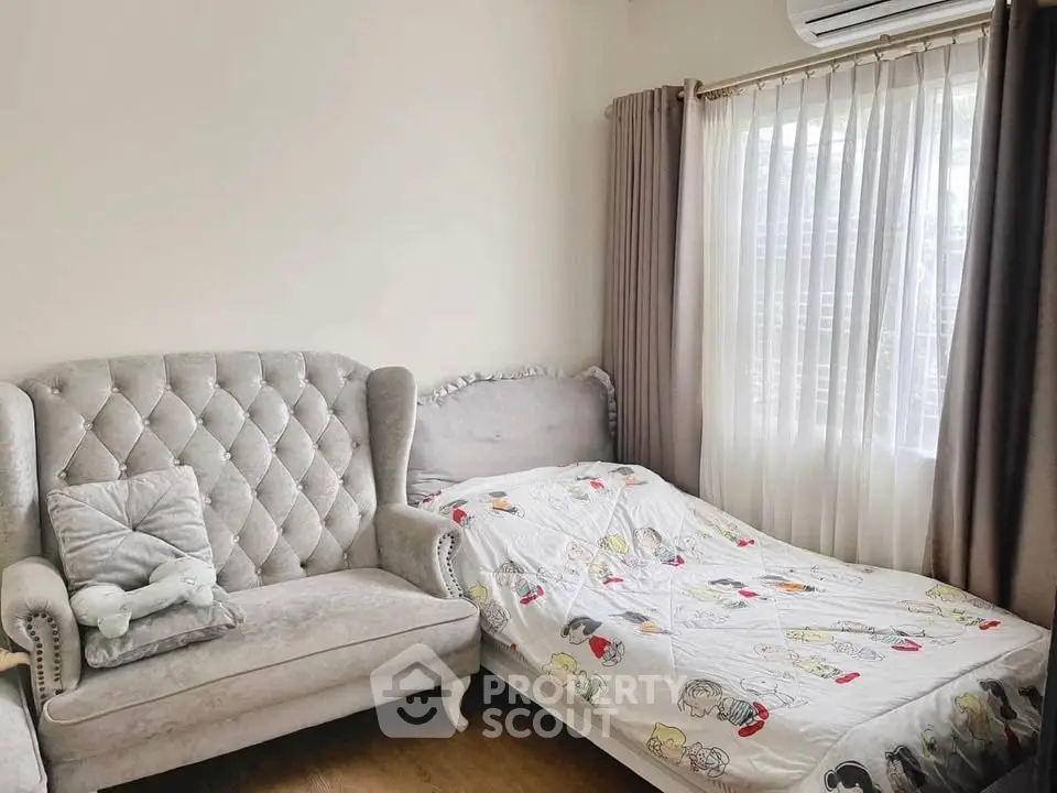 Cozy bedroom with elegant sofa and charming decor