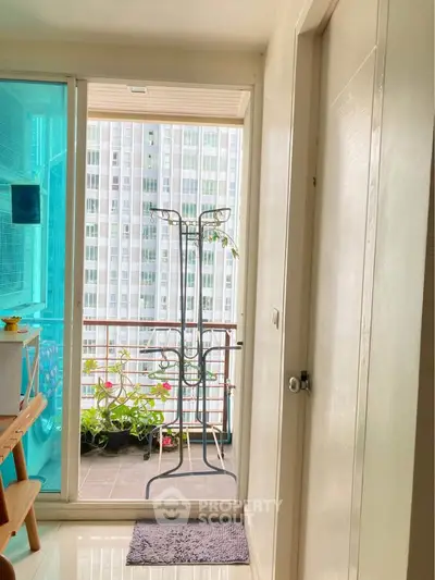 Cozy balcony with city view, perfect for relaxation and urban gardening.