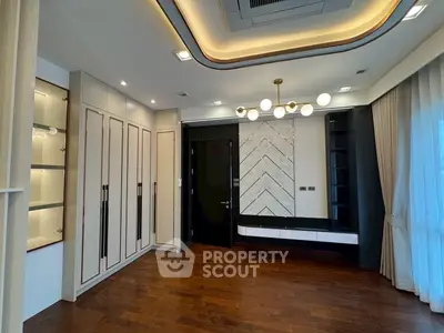 Luxurious modern living room with elegant lighting and wooden flooring