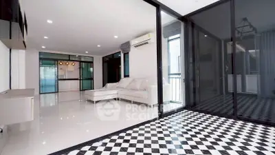 Spacious modern living room with sleek design and ample natural light