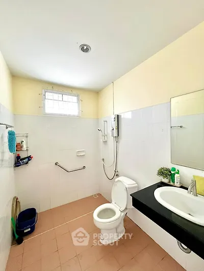 Spacious bathroom with modern fixtures and natural light