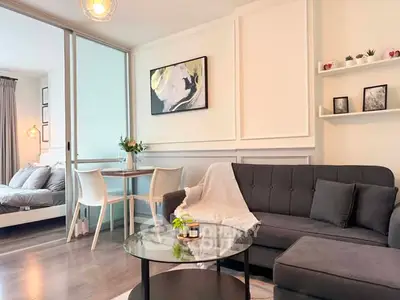 Modern living room with stylish decor and cozy seating area in a contemporary apartment.
