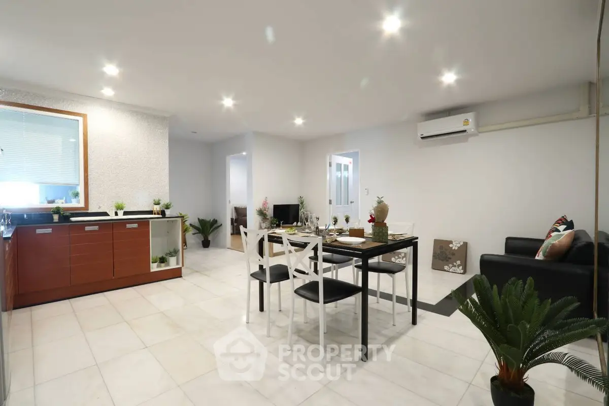 Spacious modern living room with open kitchen and elegant dining area
