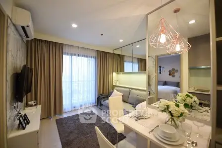 Modern living room with elegant dining area and stylish lighting in a cozy apartment.