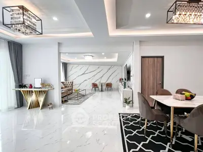 Luxurious open-plan living and dining area with modern decor and marble flooring.