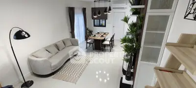 Modern living room with elegant dining area and stylish decor