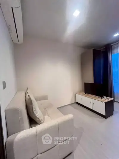 Modern living room with sleek furniture and natural light