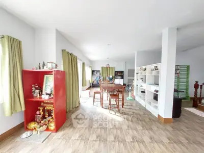 Spacious open-plan living area with modern decor and abundant natural light.