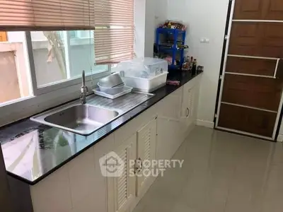 Modern kitchen with sleek countertops and ample storage space