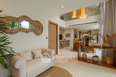 Luxurious open-plan living room with elegant decor and high ceilings, perfect for modern living.