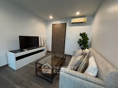 Modern living room with sleek furniture and air conditioning