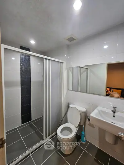 Modern bathroom with sleek shower and contemporary fixtures