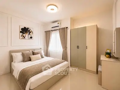 Elegant bedroom with modern decor and ample natural light