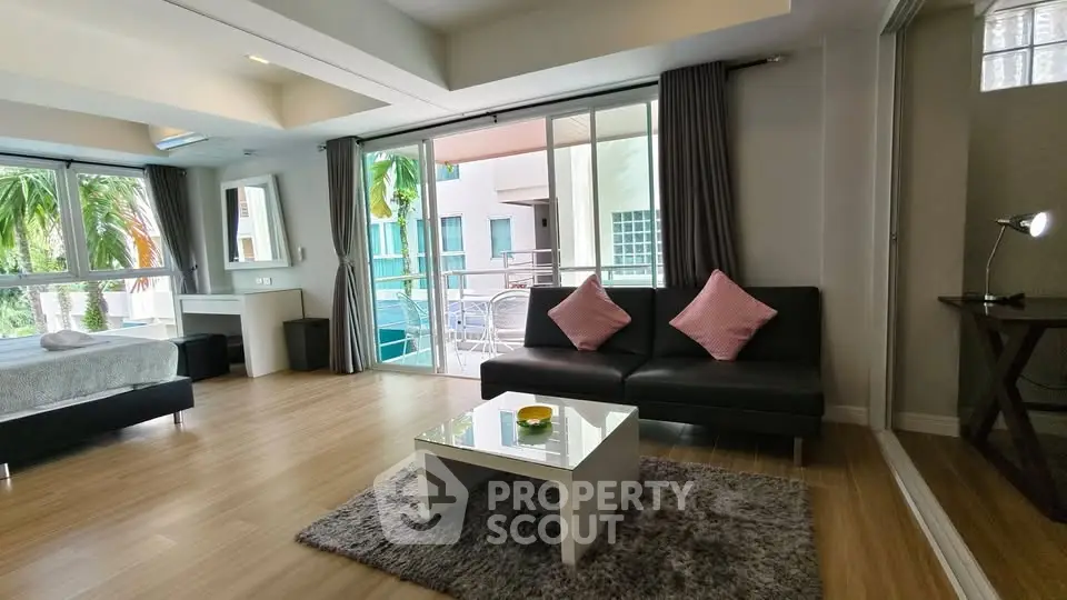 Spacious modern living room with balcony and stylish decor
